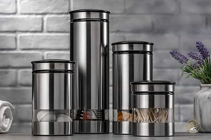 Le'raze Airtight Glass Canister Set of 4 with Stainless Steel Sleeve for Kitchen Counter - Food Storage Containers with Glass Window and Airtight Lids - Pantry Storage and Organization Set